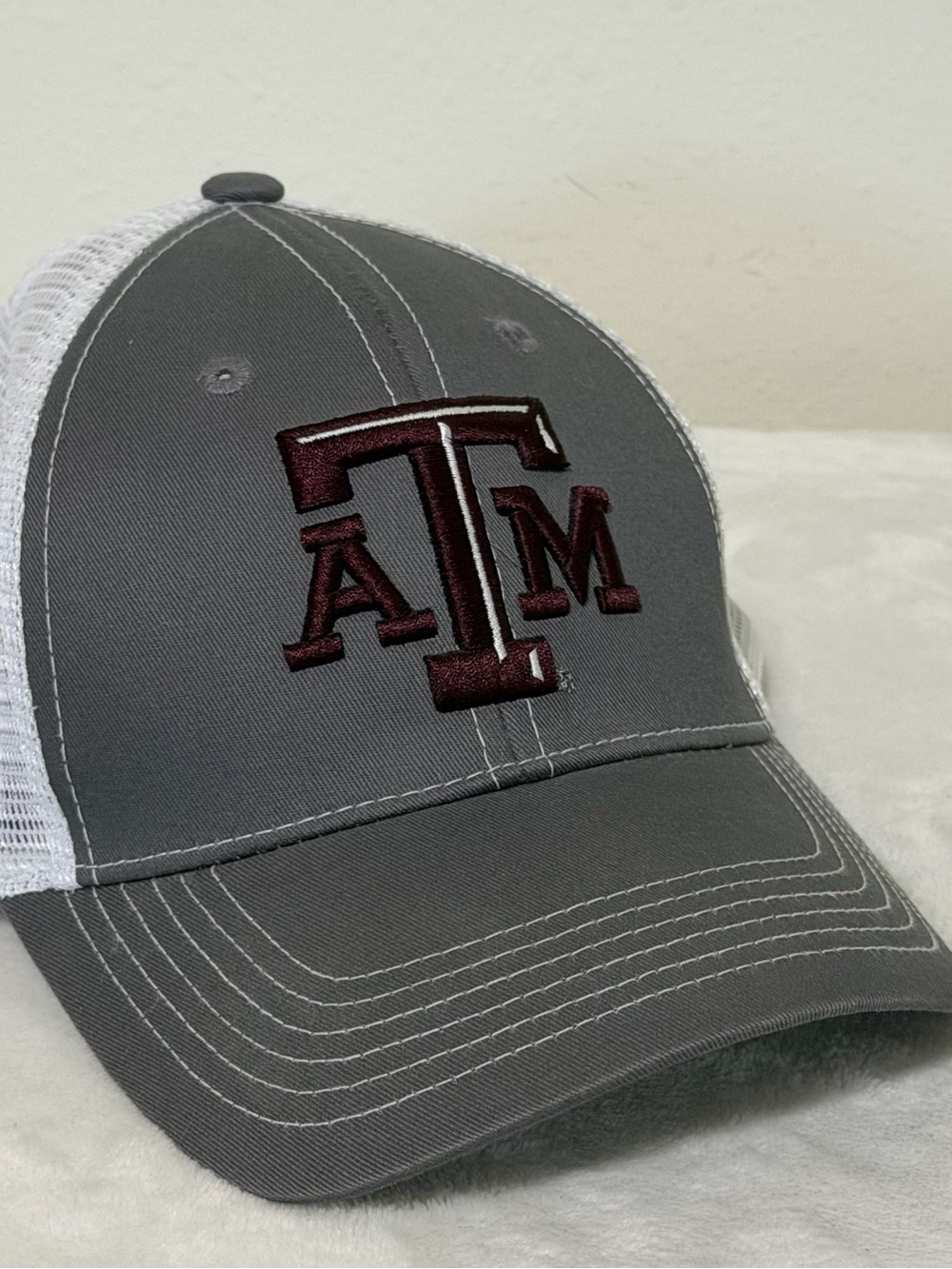 Gray and White Mesh Trucker Hat with Embroidered Maroon Logo